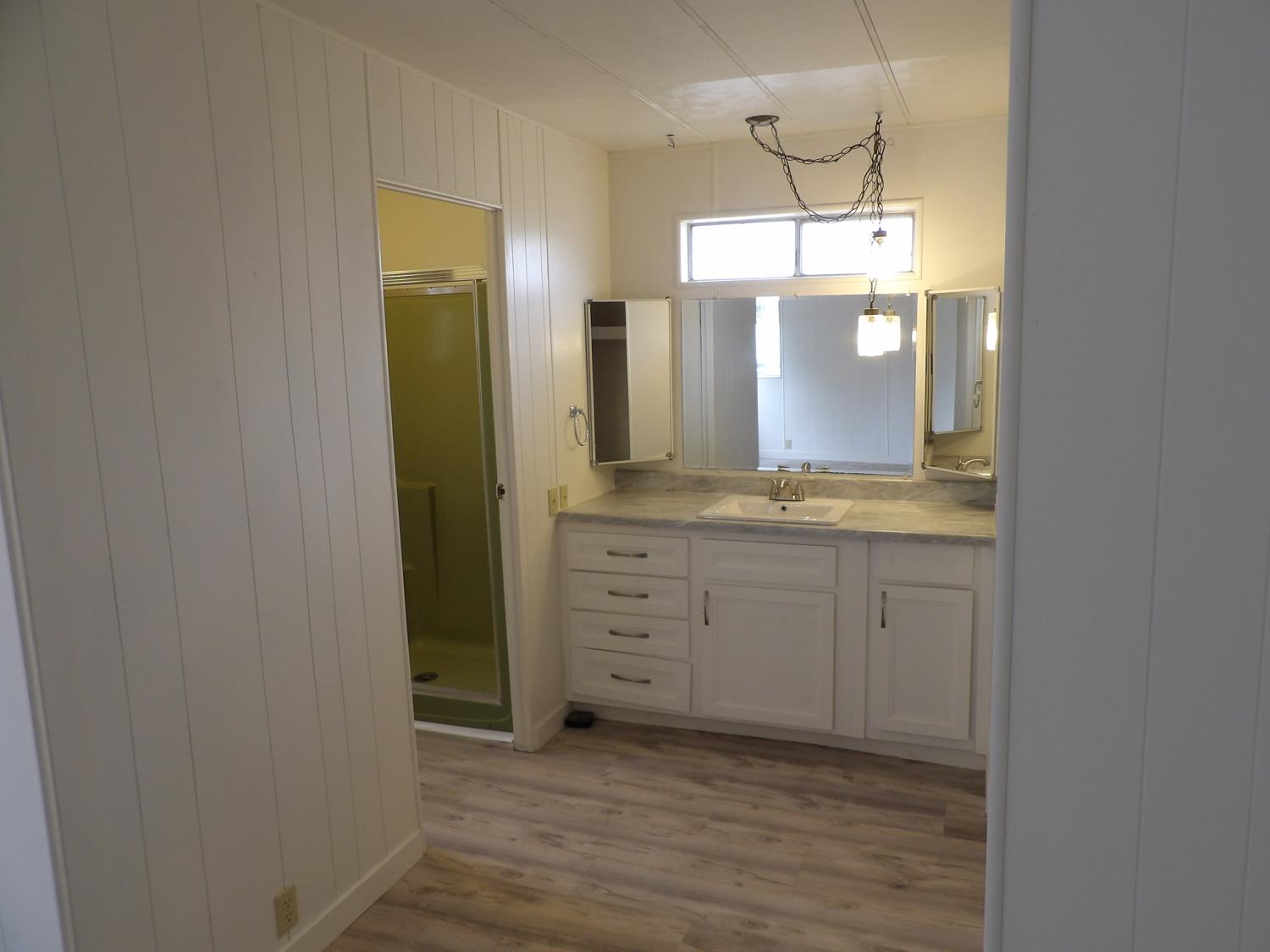 44001 Dunlap Road Miramonte, CA 93641 - Photo 77 of 91 a bathroom with a granite countertop sink and a mirror