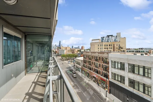 a view of a balcony with city view