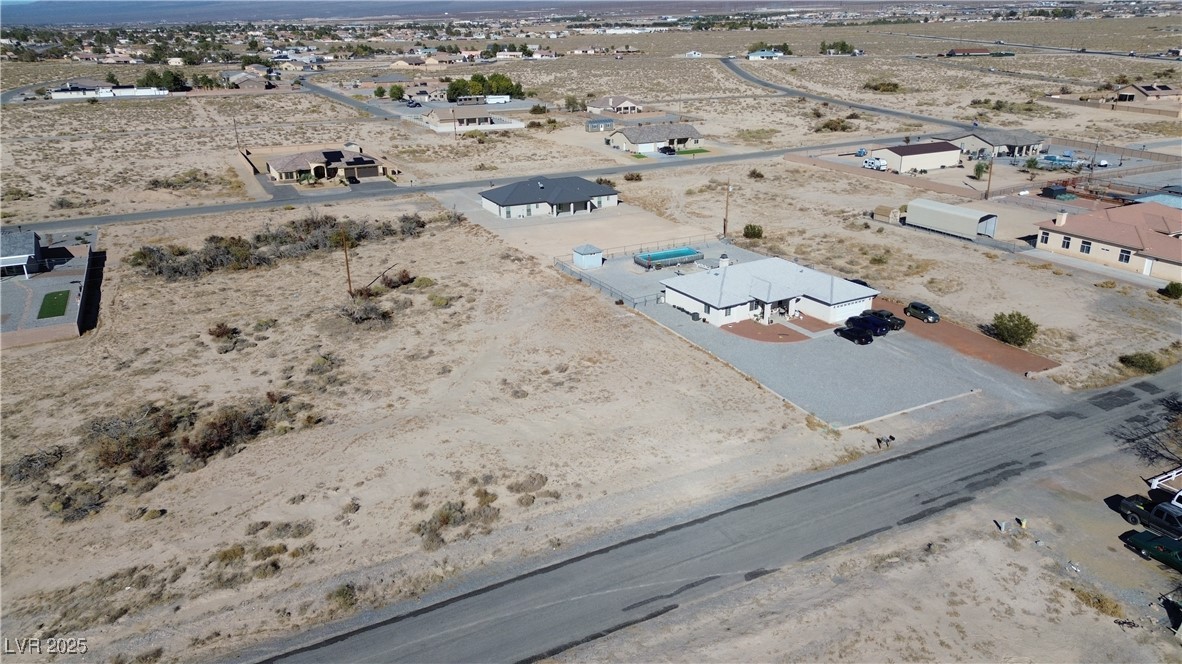 720 Intrepid Street Pahrump, NV 89048 - Photo 3 of 6 Overview of rural landscape featuring nearby suburban area and a mountainous background