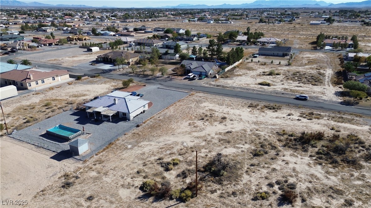 720 Intrepid Street Pahrump, NV 89048 - Photo 4 of 6 Aerial perspective of suburban area with a mountainous background