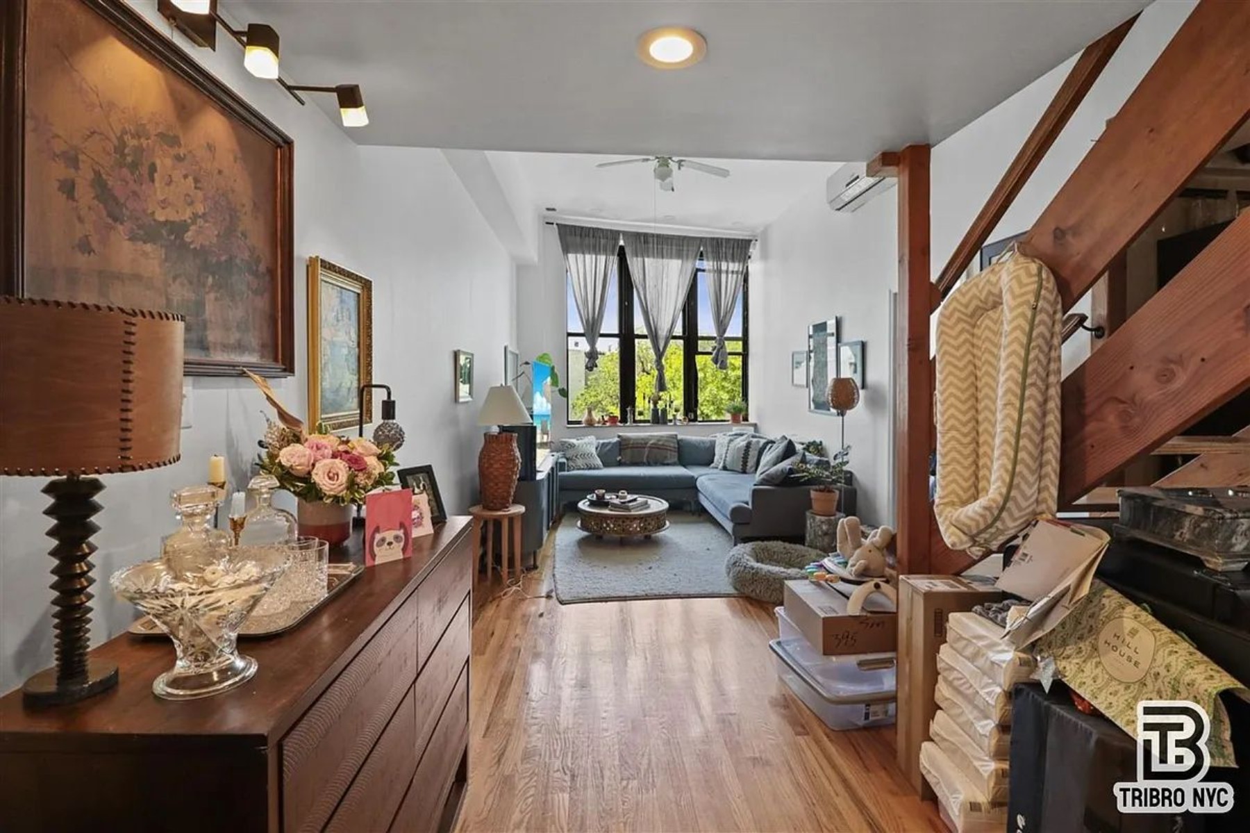 1309 Decatur Street, Unit 3C Brooklyn, NY 11207 - Photo 1 of 5 a living room with furniture fireplace and flat screen tv