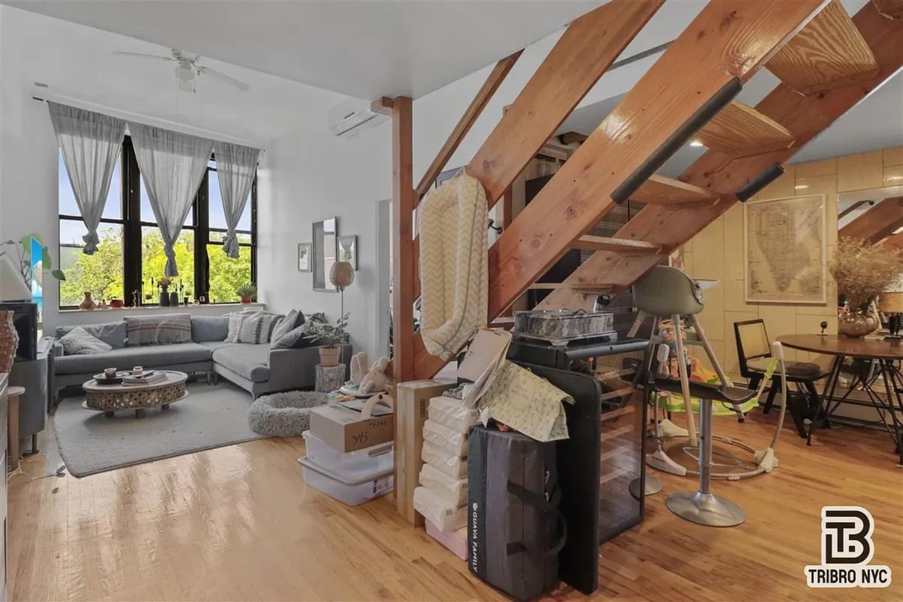 1309 Decatur Street, Unit 3C Brooklyn, NY 11207 - Photo 3 of 5 a living room with furniture and a fireplace
