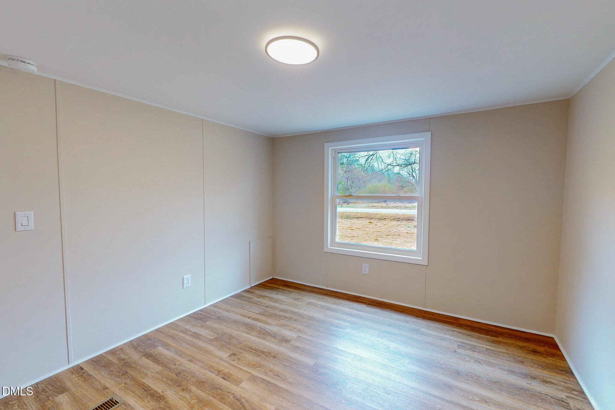 67 Halifax Road Roxboro, NC 27574 - Photo 45 of 48 a view of empty room with wooden floor and fan
