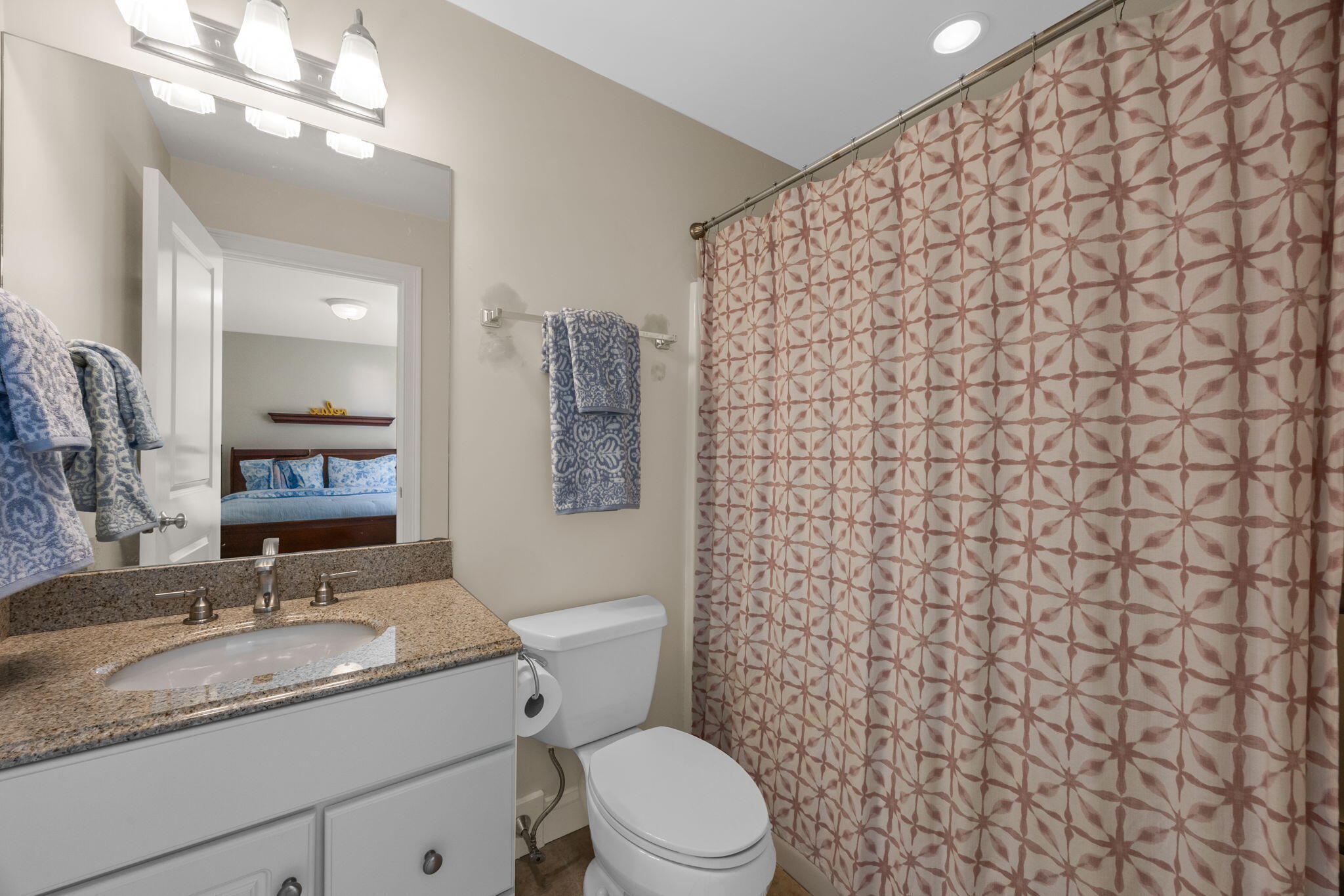 17 Payamps Road Mashpee, MA 02649 - Photo 49 of 72 a bathroom with a granite countertop toilet sink and mirror