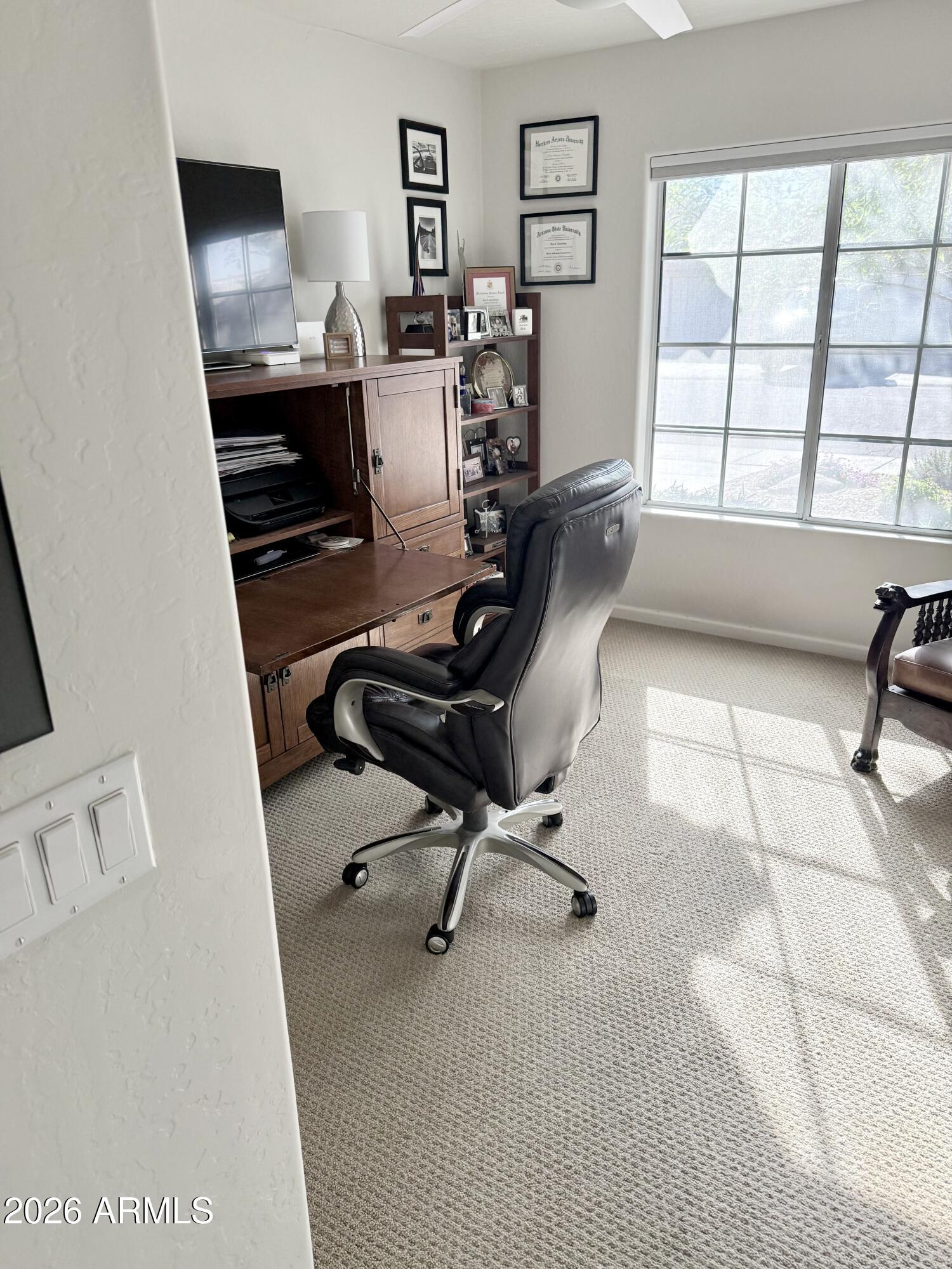 3426 East Clark Road Phoenix, AZ 85050 - Photo 10 of 48 a view of a workspace with furniture and a window