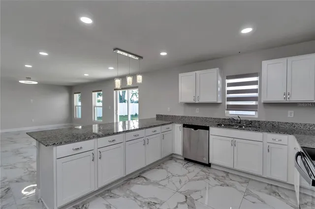 a kitchen with a sink and cabinets