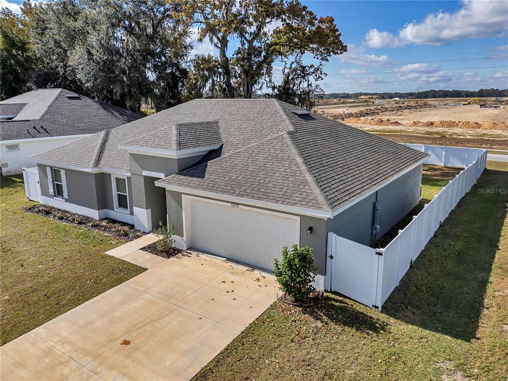 10090 Southeast 67th Terrace Belleview, FL 34420 - Photo 4 of 40 an aerial view of a house with a yard