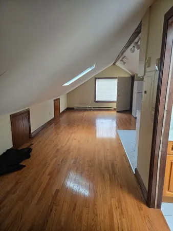 a view of hallway with wooden floor