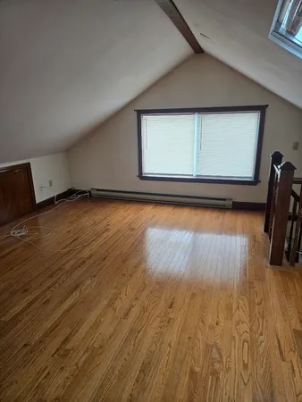 a view of a room with wooden floor and chair