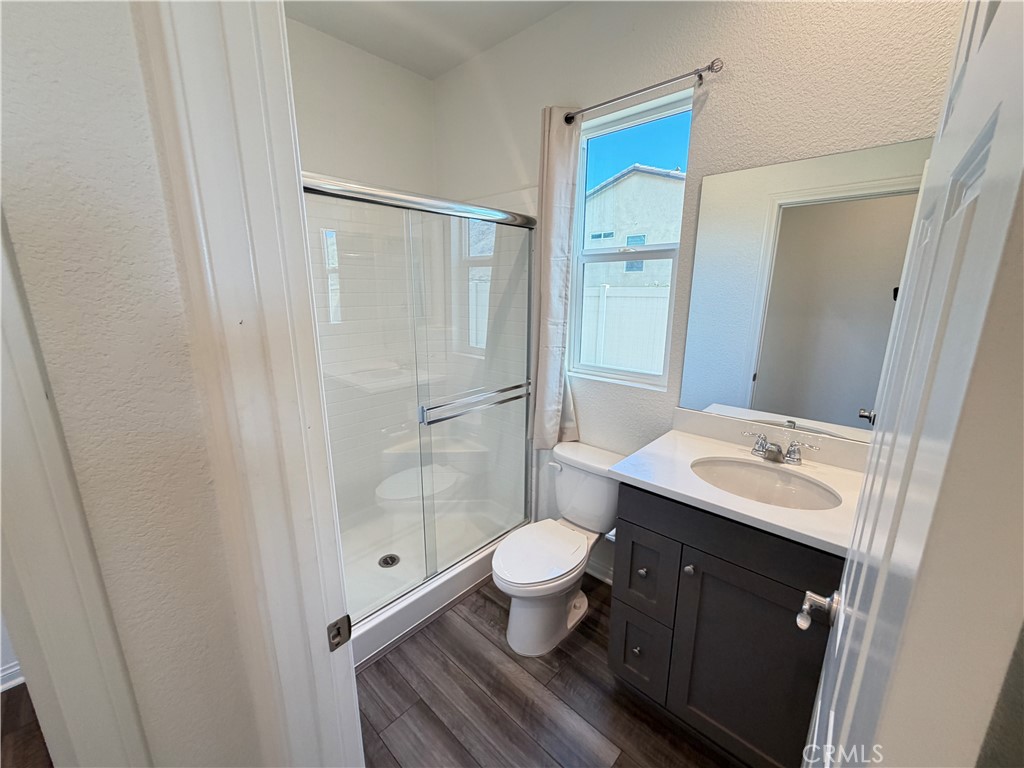 7483 Sage Scrub Road Riverside, CA 92507 - Photo 11 of 33 a bathroom with a sink and a mirror