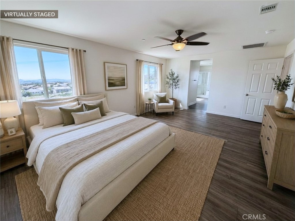 7483 Sage Scrub Road Riverside, CA 92507 - Photo 14 of 33 a bedroom with bed and a large window