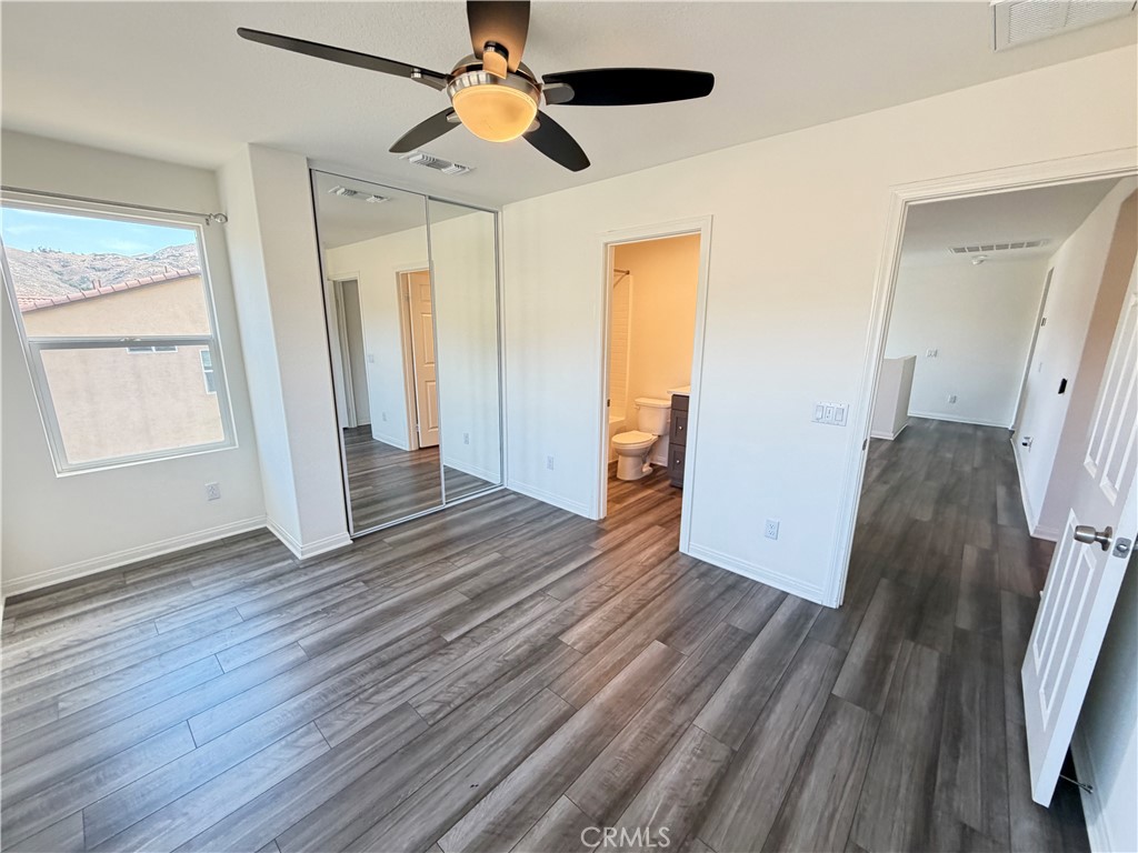 7483 Sage Scrub Road Riverside, CA 92507 - Photo 19 of 33 wooden floor in an empty room with a window