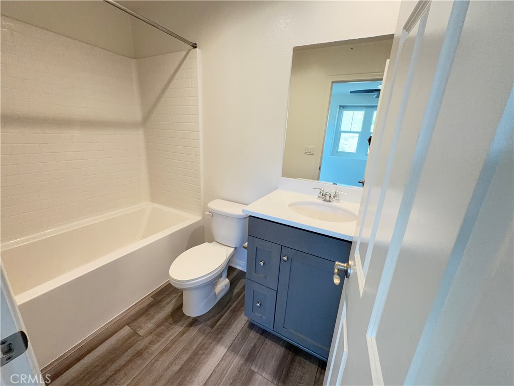 7483 Sage Scrub Road Riverside, CA 92507 - Photo 20 of 33 a bathroom with a sink a toilet and shower