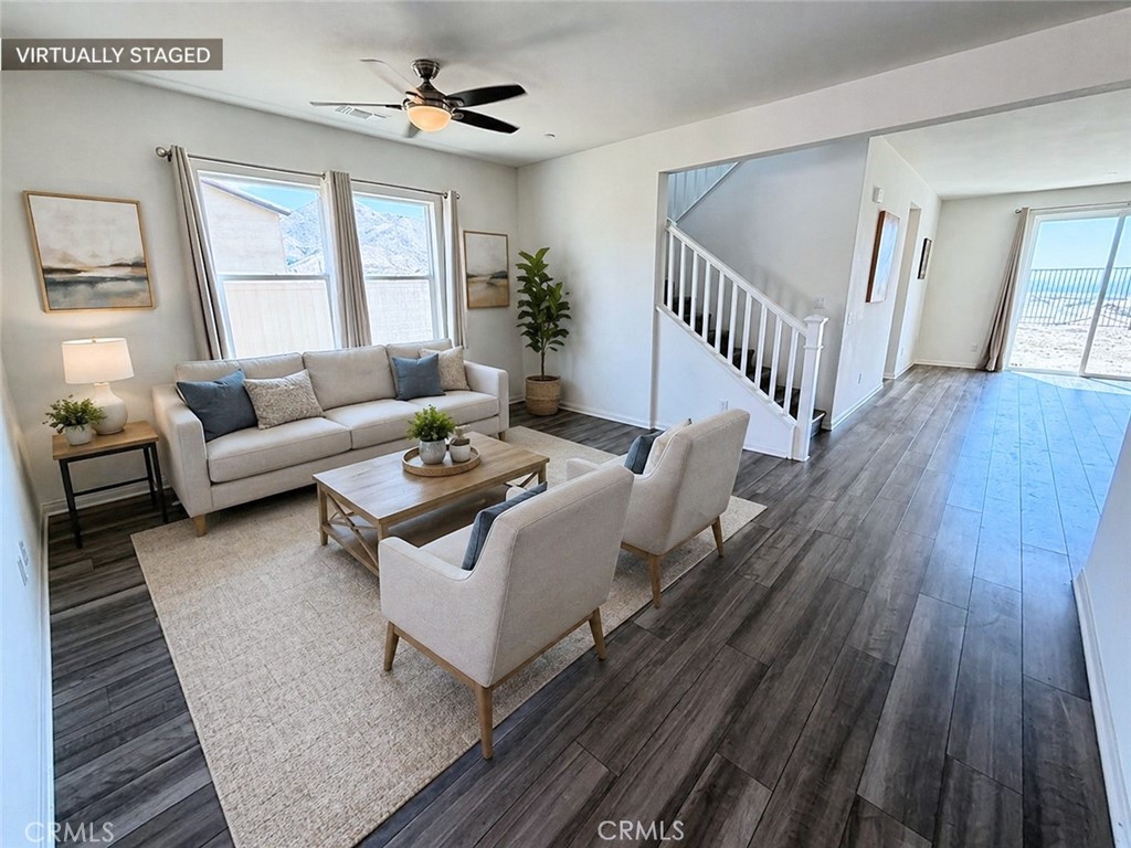 7483 Sage Scrub Road Riverside, CA 92507 - Photo 2 of 33 a living room with furniture and wooden floor