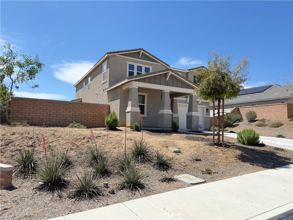 7483 Sage Scrub Road Riverside, CA 92507 - Photo 31 of 33 a front view of a house with a yard