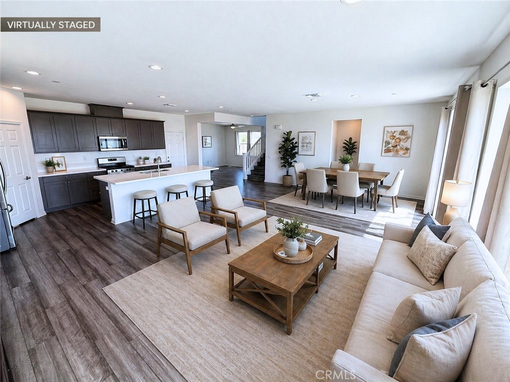 7483 Sage Scrub Road Riverside, CA 92507 - Photo 4 of 33 a living room with furniture and a wooden floor