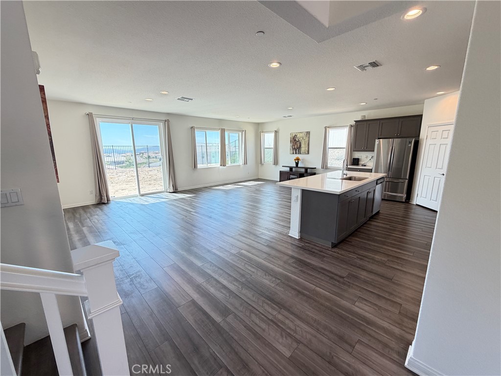 7483 Sage Scrub Road Riverside, CA 92507 - Photo 6 of 33 a view of a living room hardwood floor and a window
