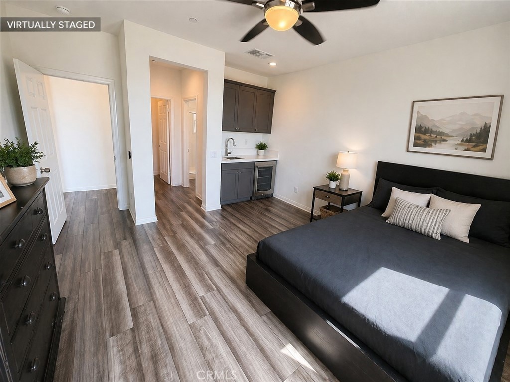 7483 Sage Scrub Road Riverside, CA 92507 - Photo 8 of 33 a living room with furniture and a flat screen tv
