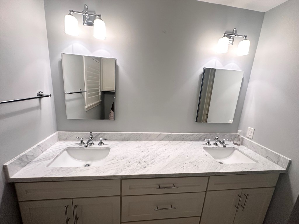 2123 Ridgecrest Drive Houston, TX 77055 - Photo 20 of 38 a bathroom with a sink and a mirror