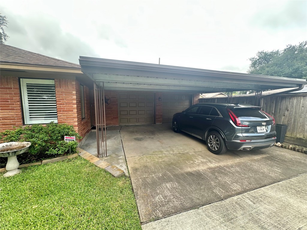 2123 Ridgecrest Drive Houston, TX 77055 - Photo 29 of 38 a car parked in front of white house