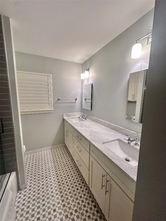 2123 Ridgecrest Drive Houston, TX 77055 - Photo 37 of 38 a bathroom with a sink a double vanity and a mirror