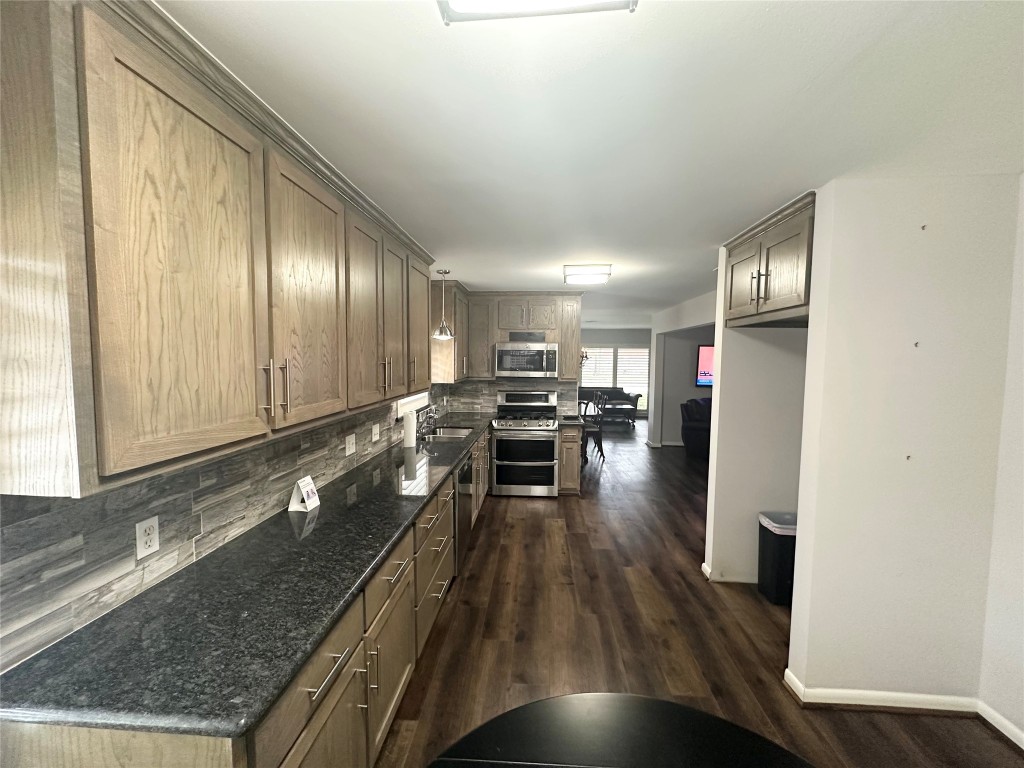 2123 Ridgecrest Drive Houston, TX 77055 - Photo 7 of 38 a kitchen with a sink and wooden floor