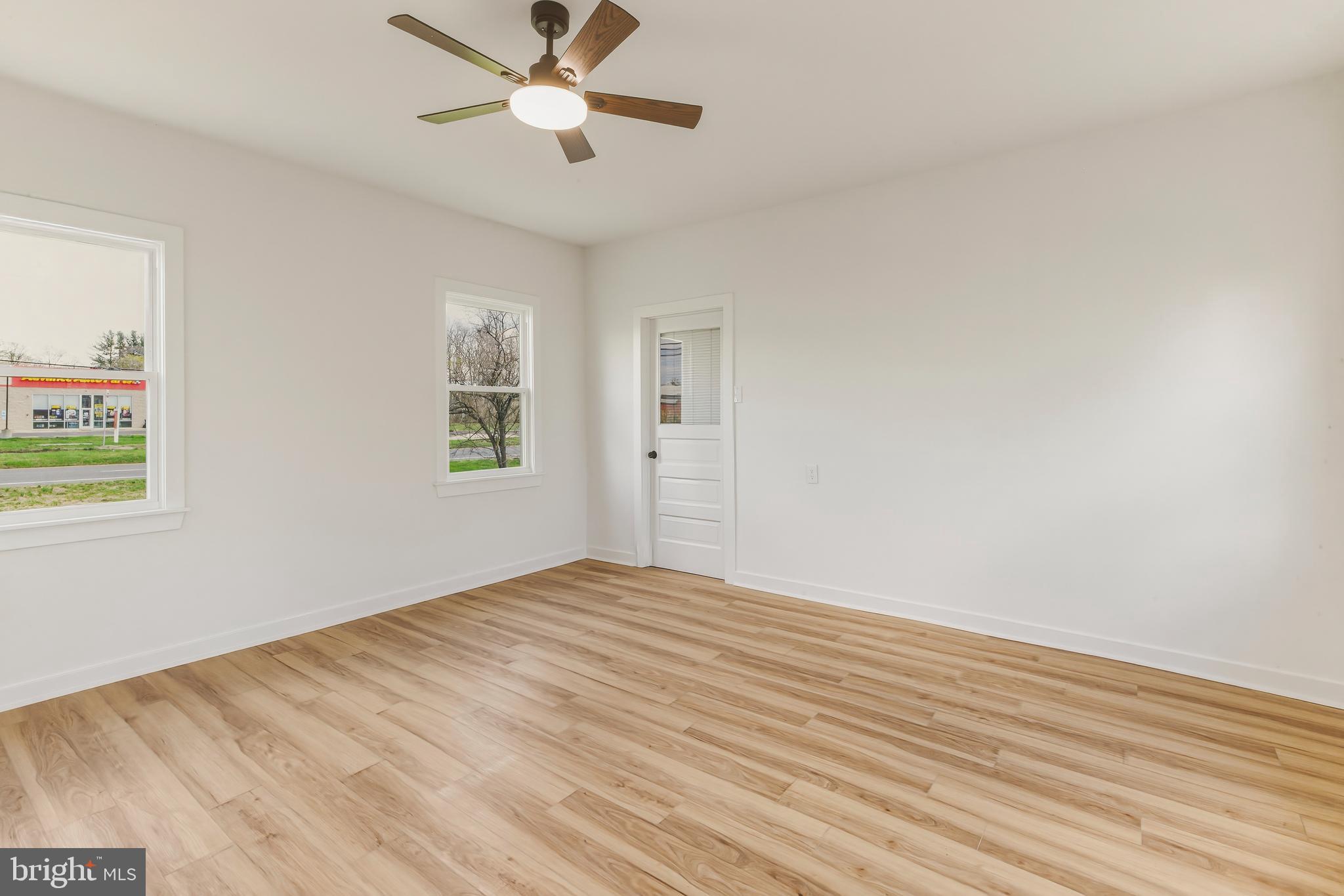 110 Washington Avenue Williamstown, NJ 08094 - Photo 16 of 32 a view of empty room with wooden floor and fan