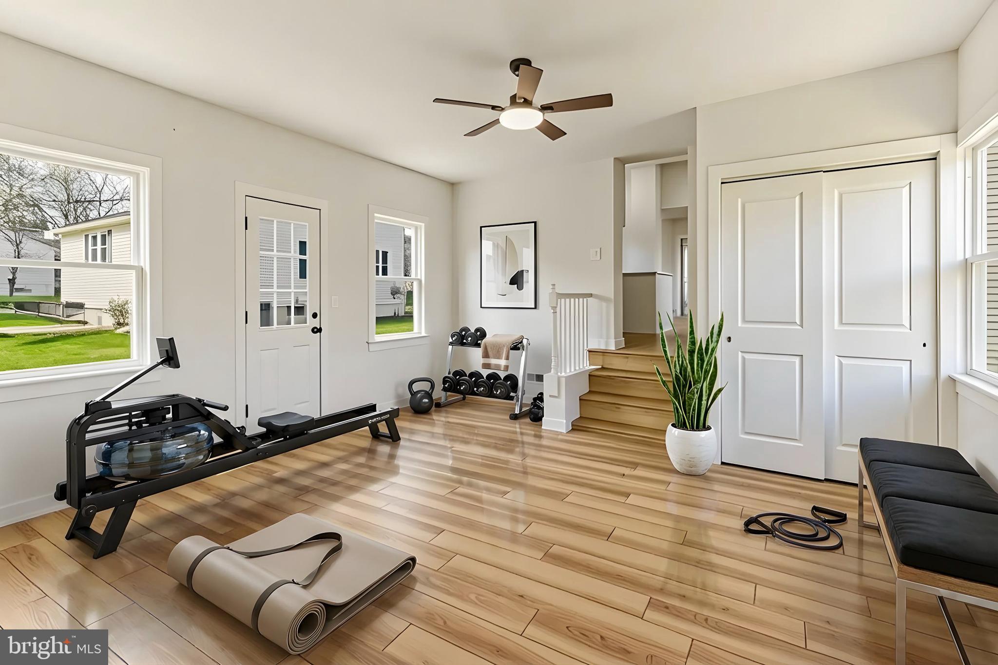 110 Washington Avenue Williamstown, NJ 08094 - Photo 18 of 32 a room with furniture gym equipment and view of living room