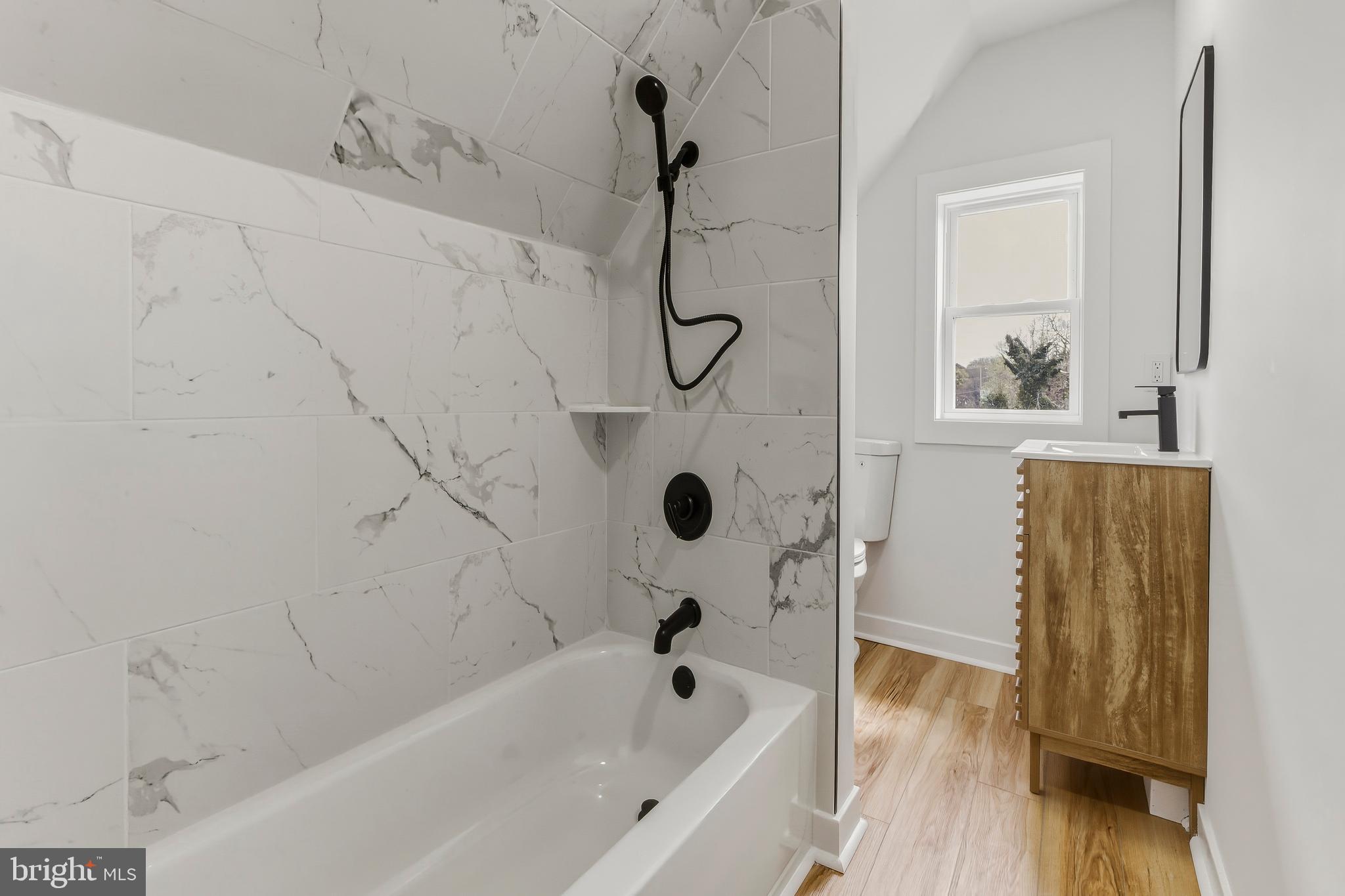 110 Washington Avenue Williamstown, NJ 08094 - Photo 26 of 32 a bathroom with a bathtub and a shower