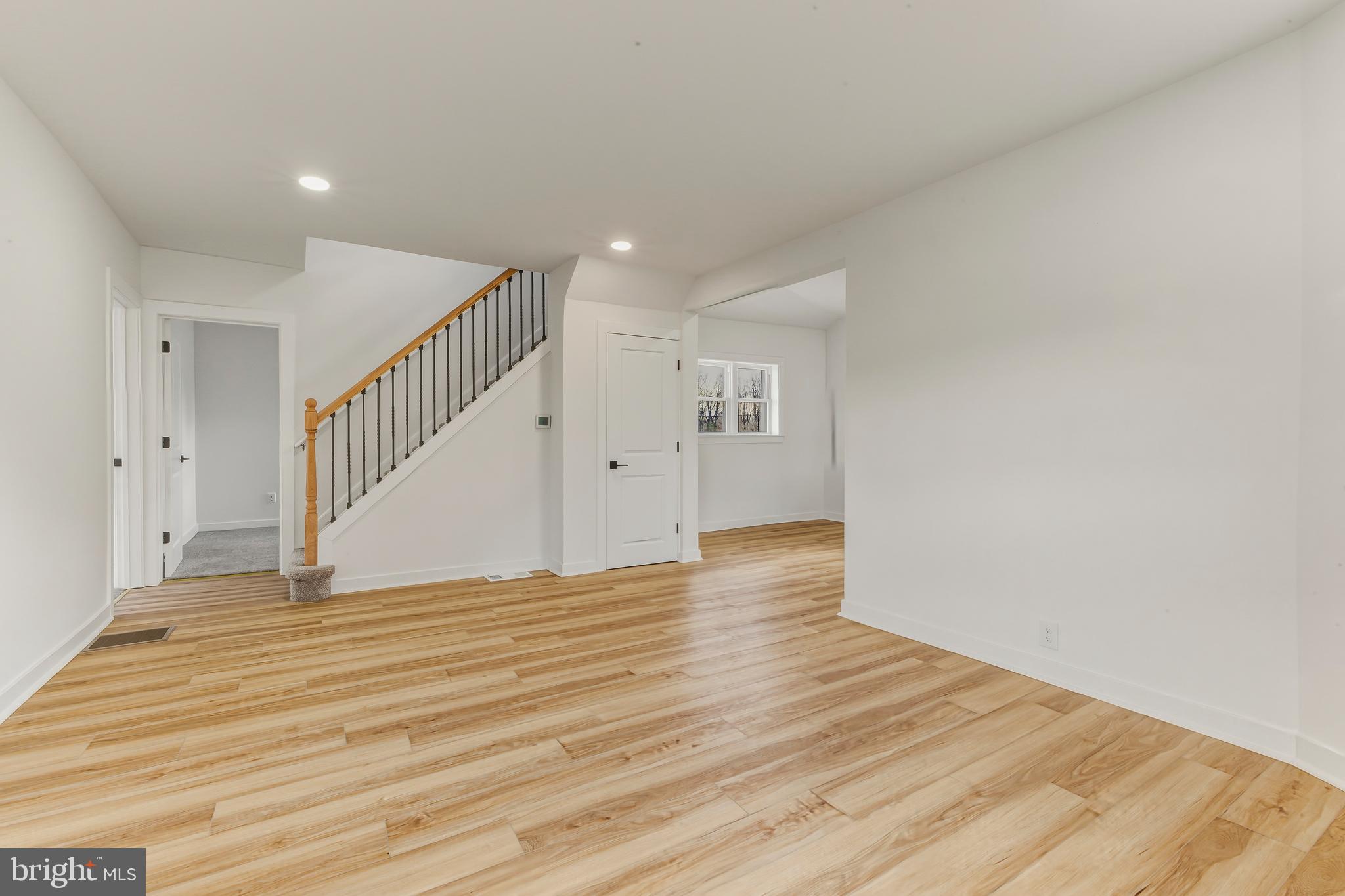 110 Washington Avenue Williamstown, NJ 08094 - Photo 4 of 32 a view of empty room with wooden floor