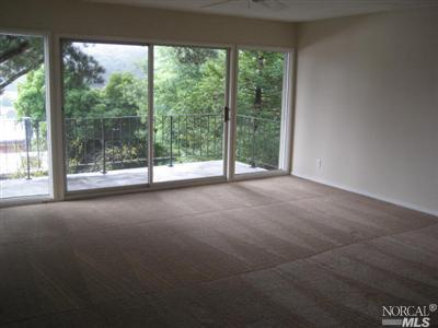 365 Eden Roc Drive Sausalito, CA 94965 - Photo 3 of 8 a view of a room with large windows and city view