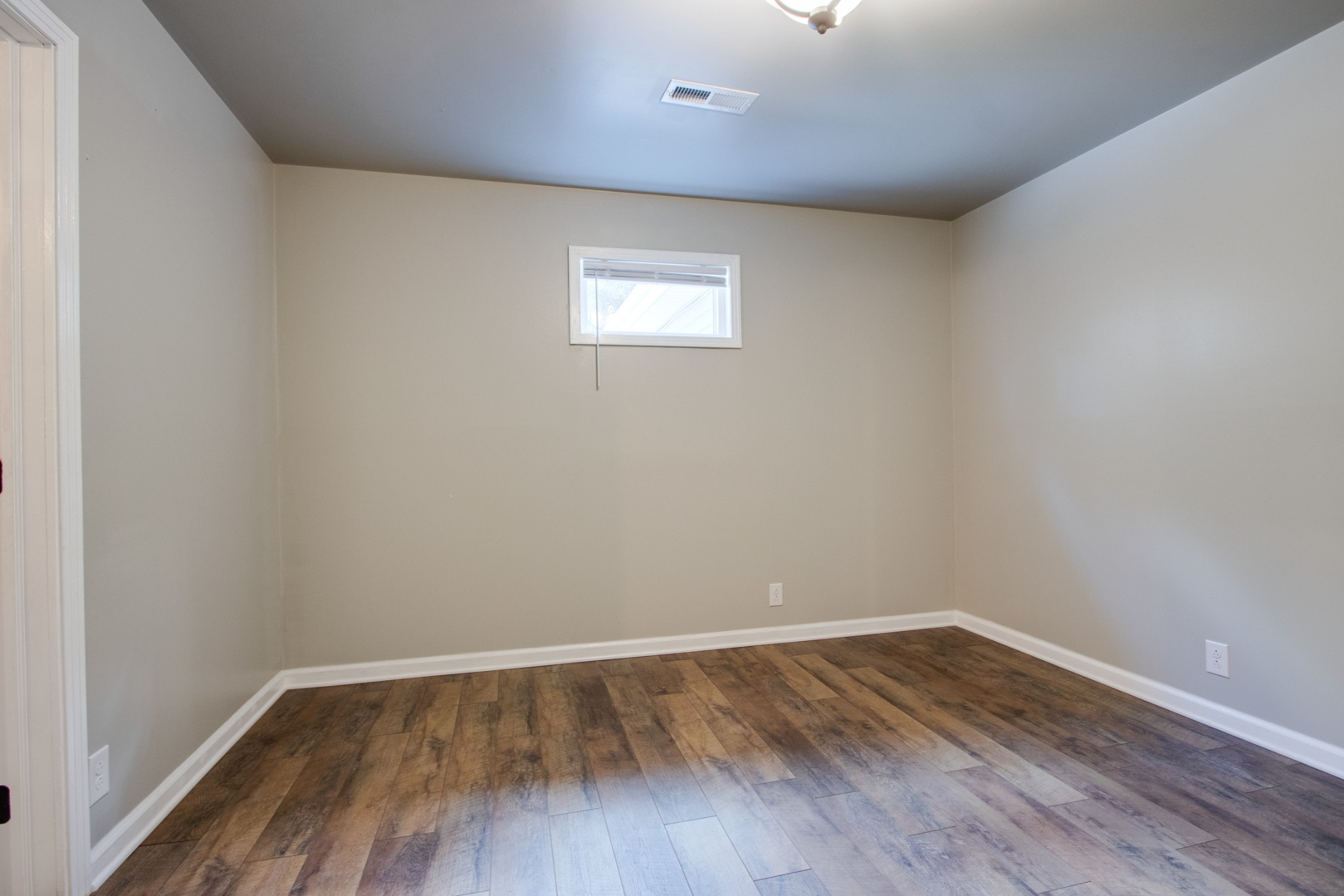 274 Hiwassee Road Lebanon, TN 37087 - Photo 17 of 44 a view of an empty room with wooden floor and a window