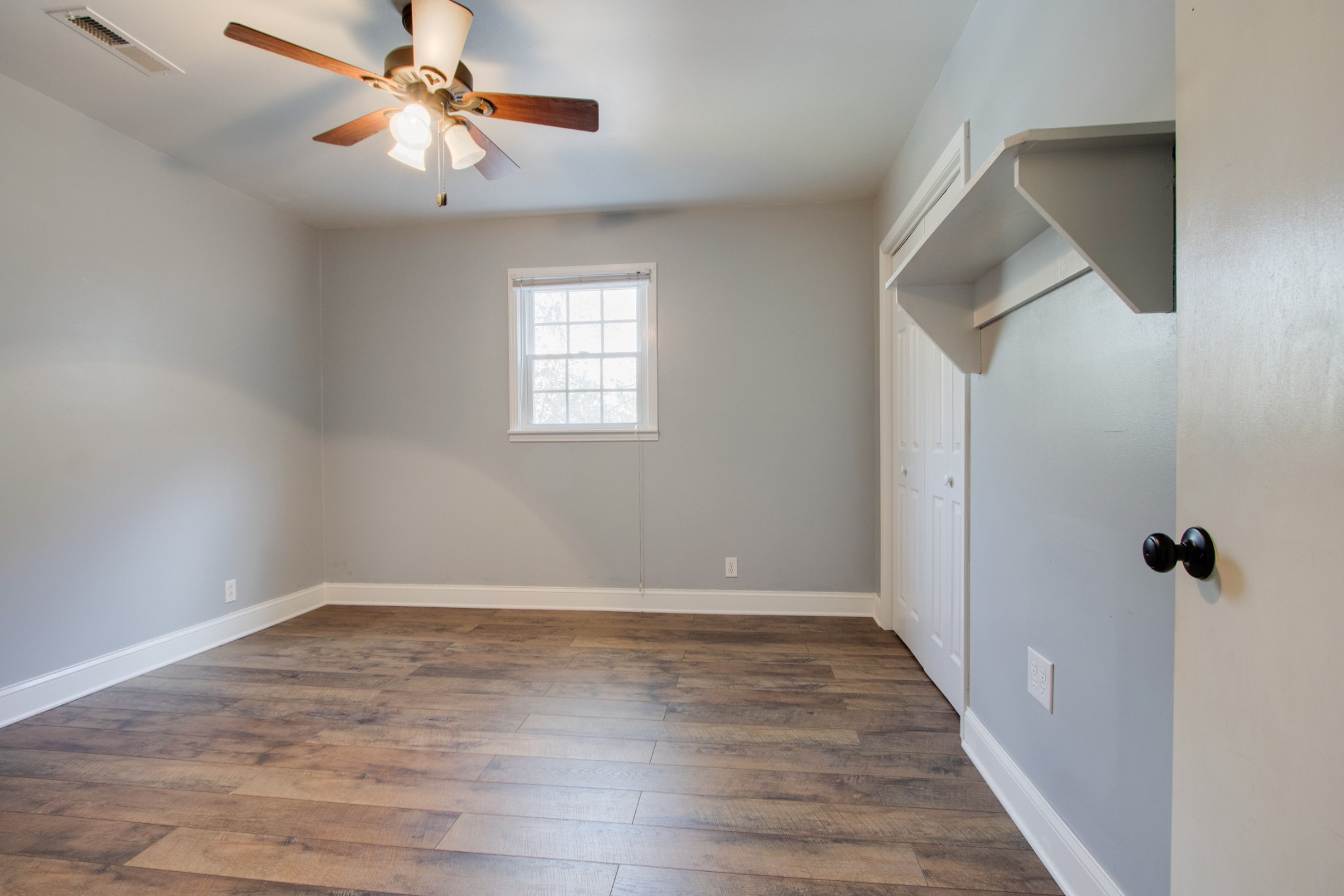 274 Hiwassee Road Lebanon, TN 37087 - Photo 24 of 44 wooden floor in an empty room with a window