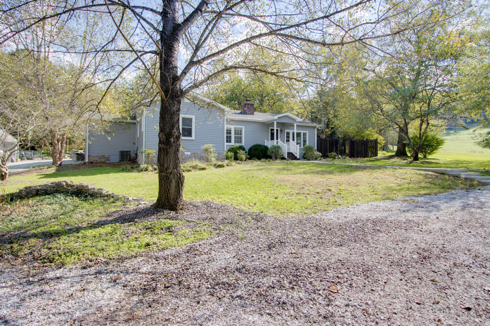 274 Hiwassee Road Lebanon, TN 37087 - Photo 4 of 44 a view of a house with a yard covered in the forest