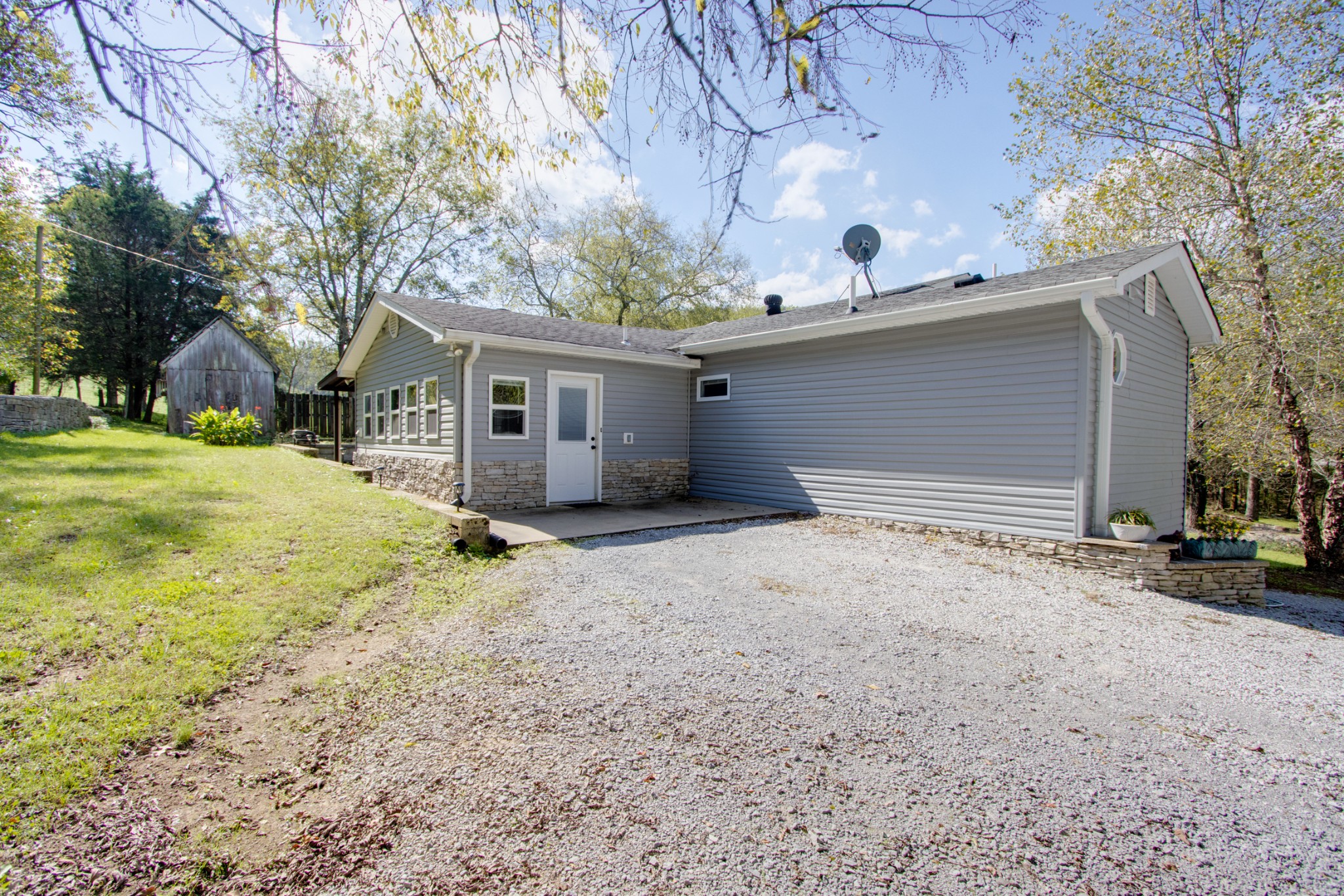 274 Hiwassee Road Lebanon, TN 37087 - Photo 36 of 44 a front view of house with yard and trees in the background
