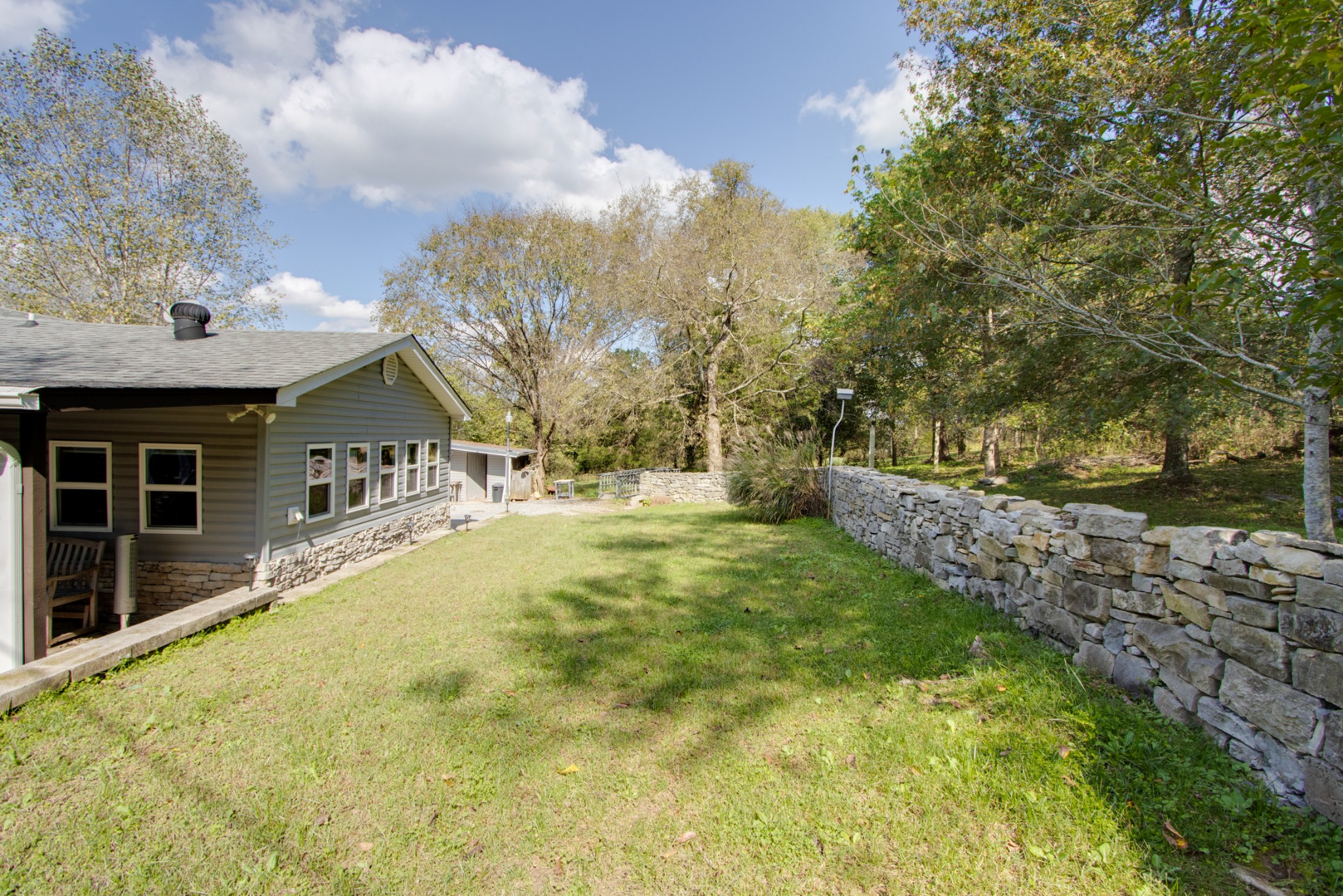 274 Hiwassee Road Lebanon, TN 37087 - Photo 42 of 44 a view of house with yard and trees in the background