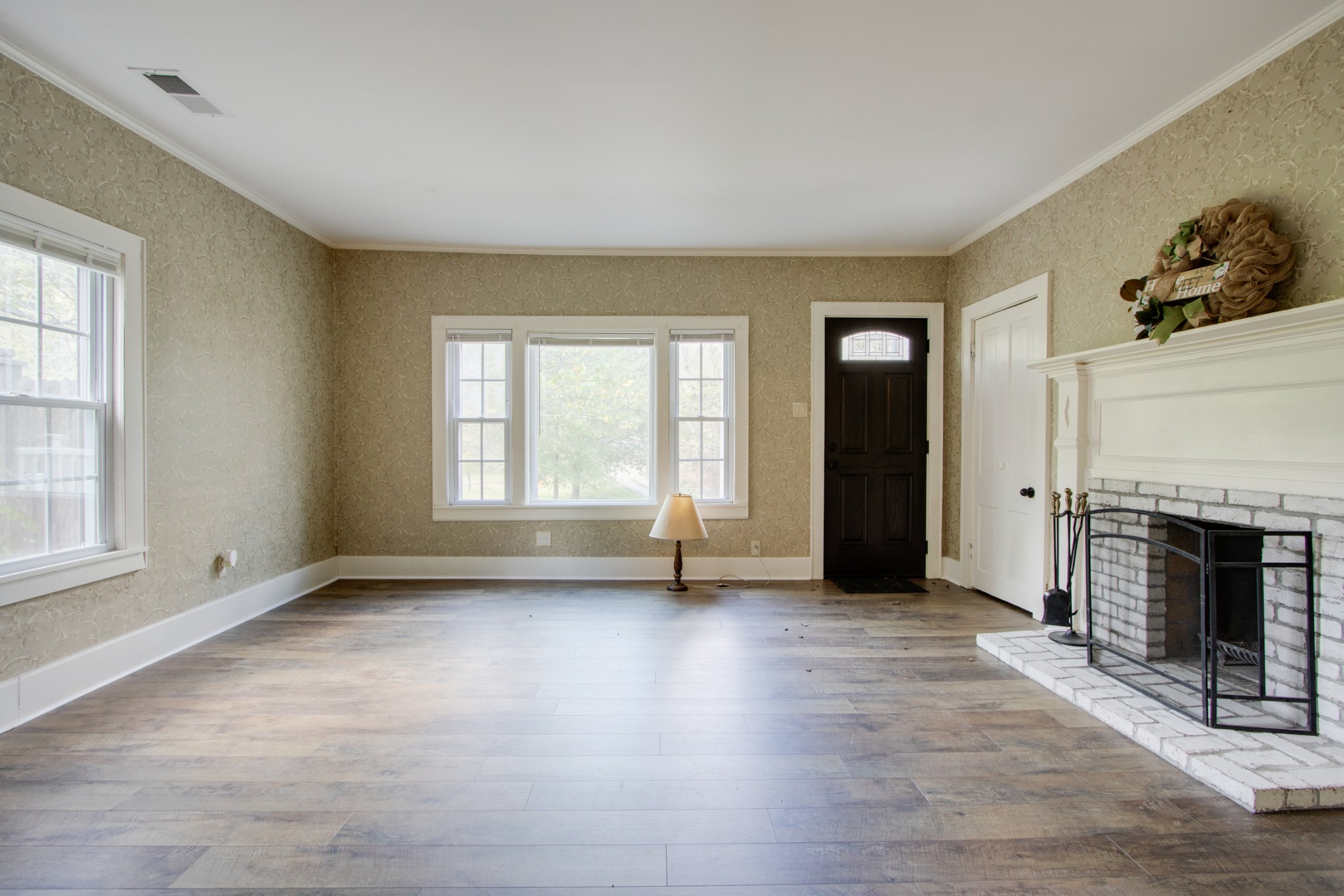 274 Hiwassee Road Lebanon, TN 37087 - Photo 7 of 44 an empty room with windows and fireplace