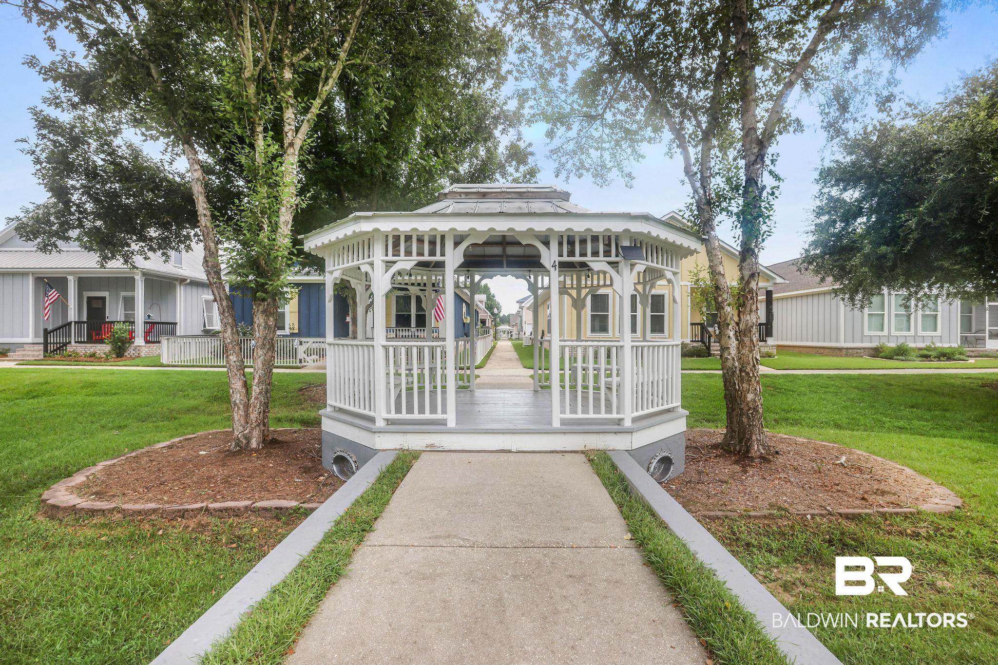 1116 Pink Poppy Lane Foley, AL 36535 - Photo 28 of 33 View of community featuring a gazebo and a lawn
