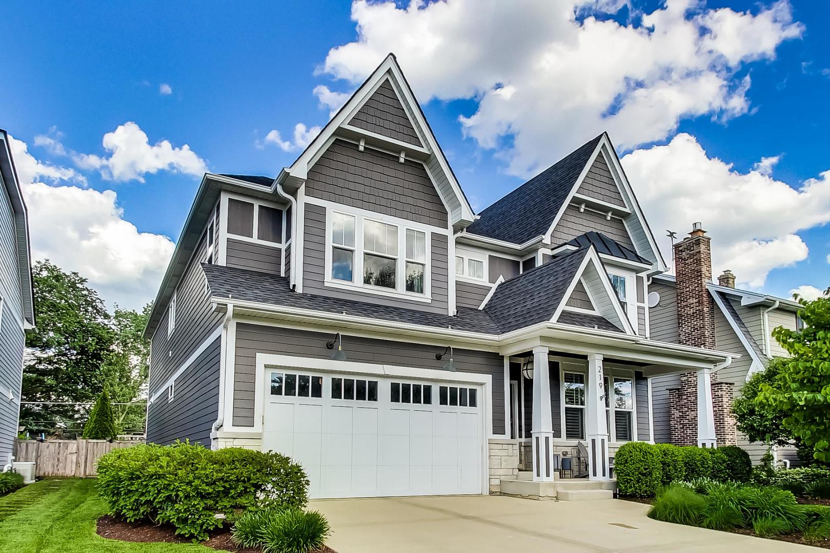219 Clinton Avenue Elmhurst, IL 60126 - Photo 1 of 49 a front view of a house with a yard