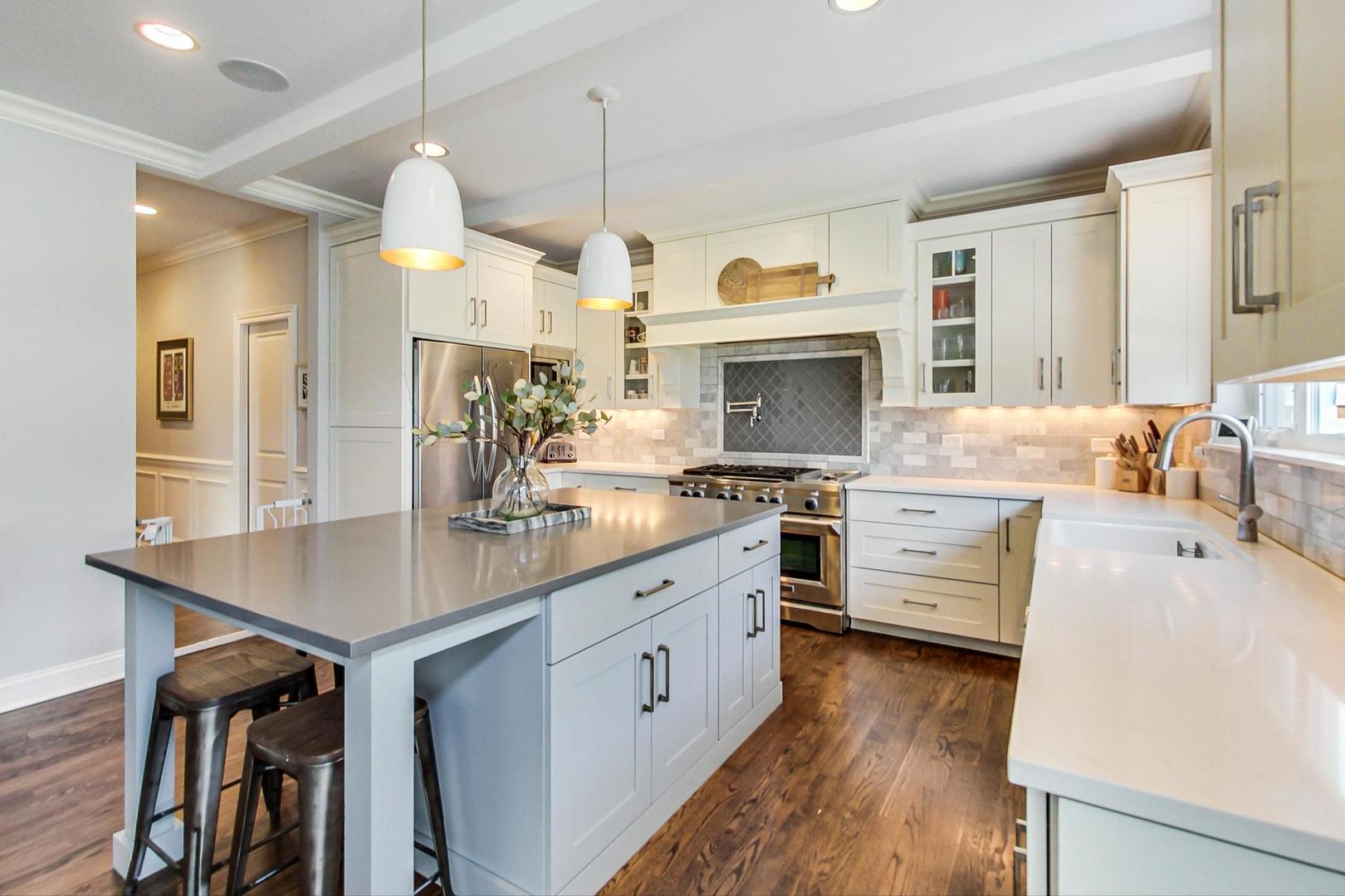 219 Clinton Avenue Elmhurst, IL 60126 - Photo 14 of 49 a kitchen with granite countertop a sink cabinets and wooden floor