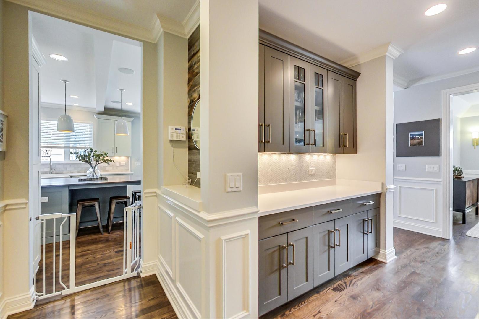 219 Clinton Avenue Elmhurst, IL 60126 - Photo 17 of 49 a kitchen with granite countertop white cabinets and white appliances
