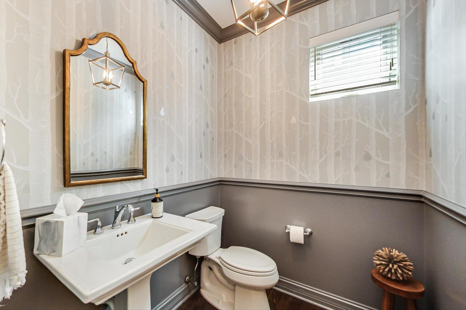 219 Clinton Avenue Elmhurst, IL 60126 - Photo 18 of 49 a bathroom with a sink a toilet and a mirror