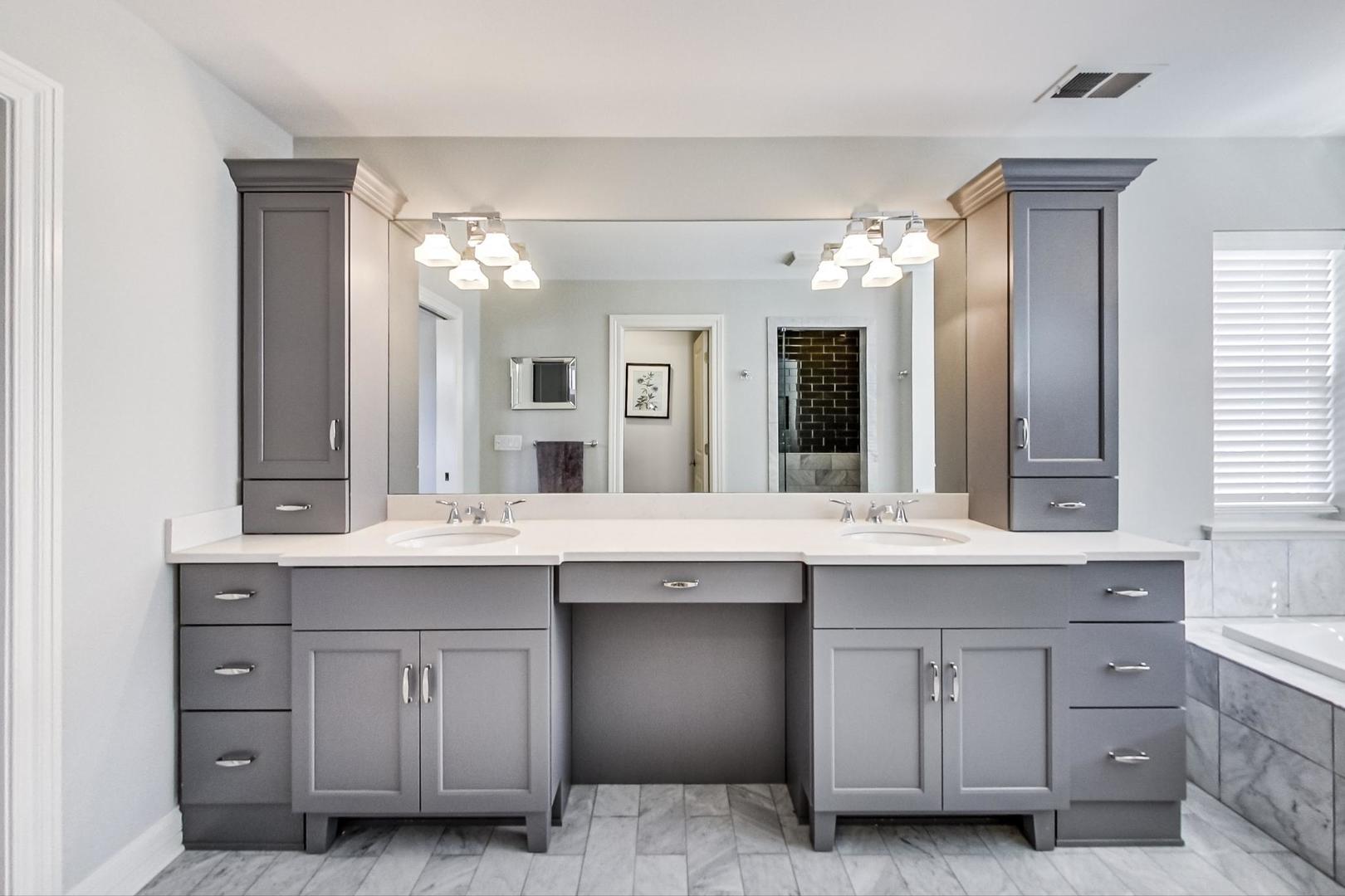 219 Clinton Avenue Elmhurst, IL 60126 - Photo 23 of 49 a spacious bathroom with a granite countertop double sink and a mirror