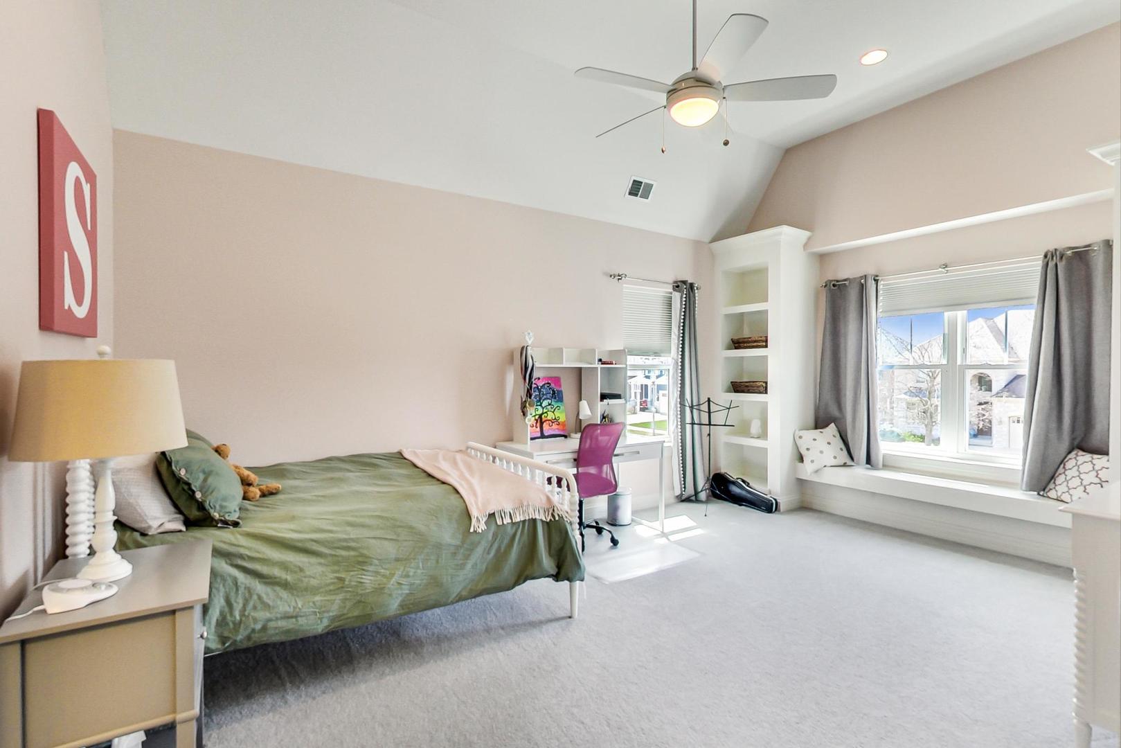 219 Clinton Avenue Elmhurst, IL 60126 - Photo 27 of 49 a bedroom with bed and a large window