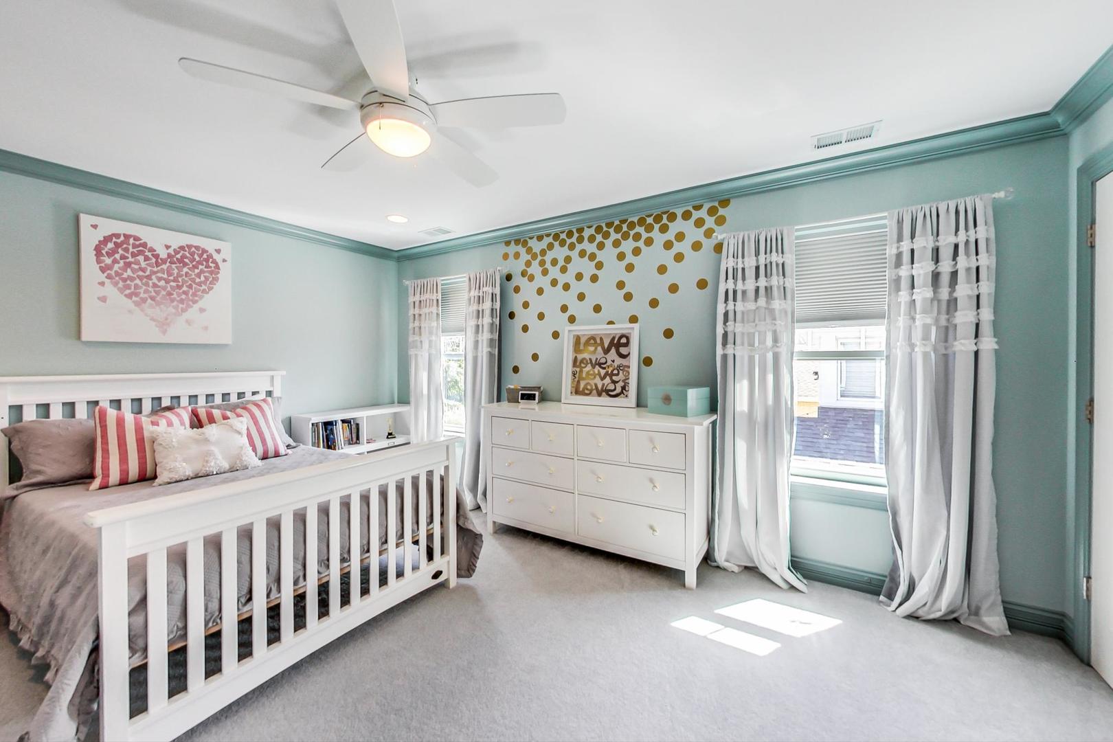 219 Clinton Avenue Elmhurst, IL 60126 - Photo 30 of 49 a bedroom with a bed and a window