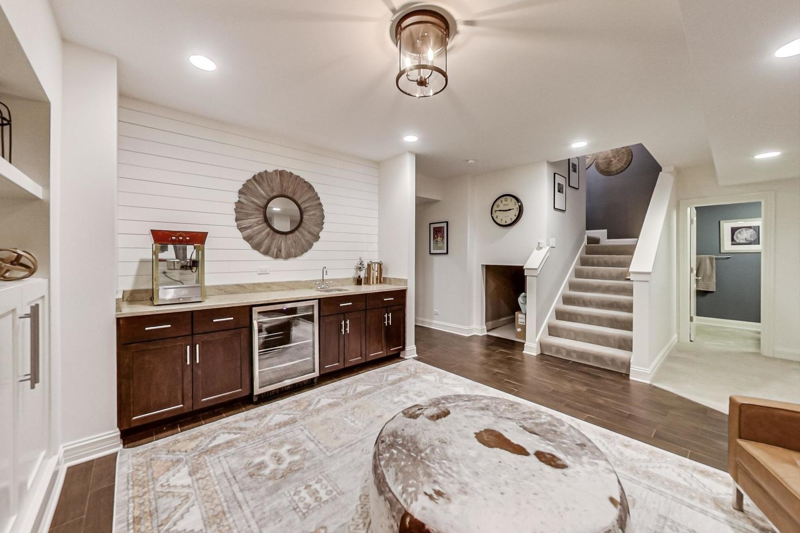 219 Clinton Avenue Elmhurst, IL 60126 - Photo 36 of 49 a kitchen with a refrigerator a sink and a stove