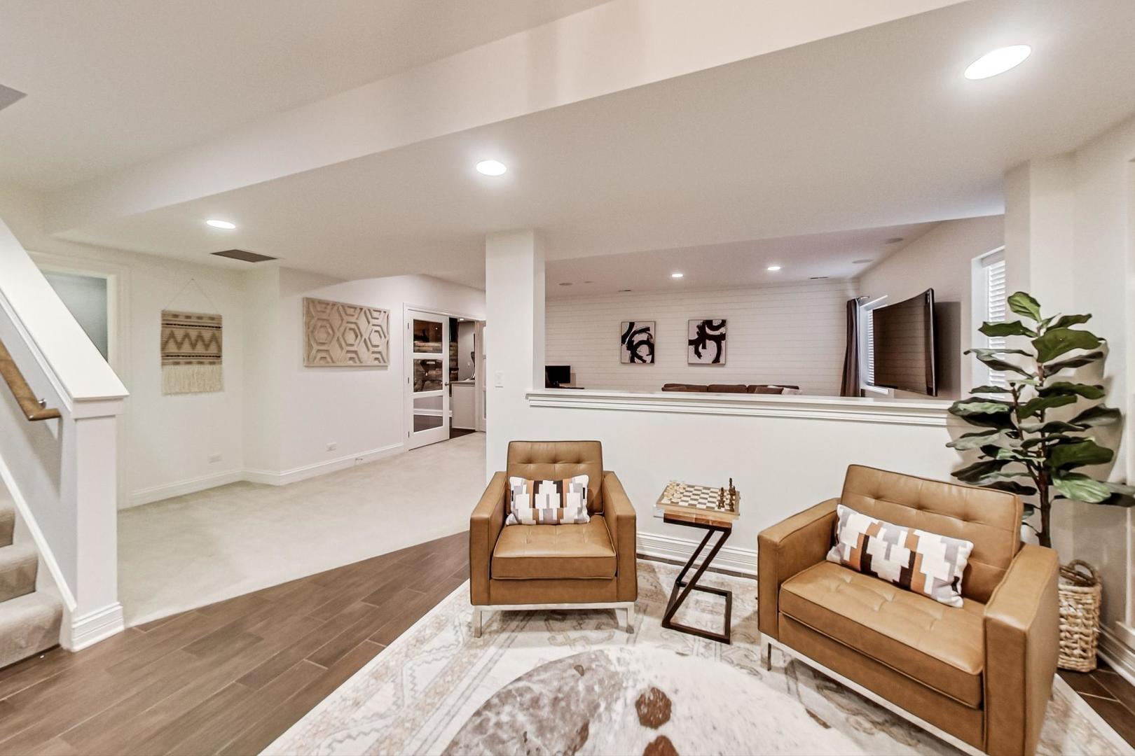 219 Clinton Avenue Elmhurst, IL 60126 - Photo 37 of 49 a living room with furniture and a couch