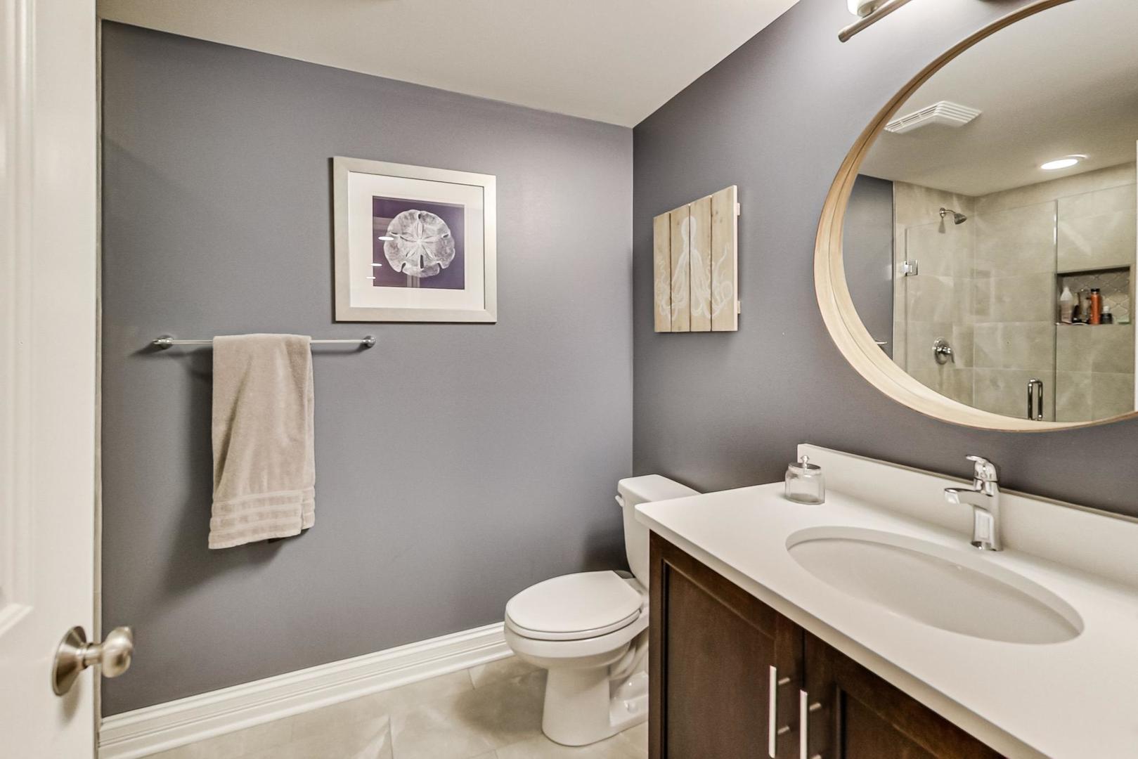 219 Clinton Avenue Elmhurst, IL 60126 - Photo 40 of 49 a bathroom with a sink toilet and mirror