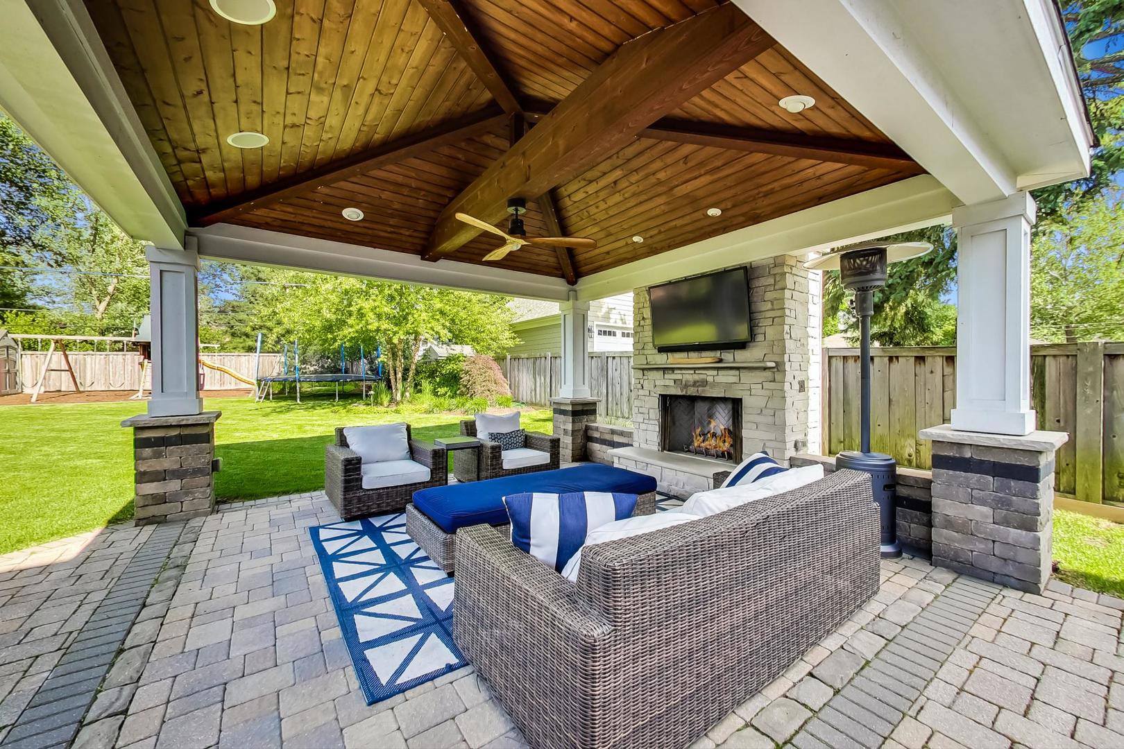 219 Clinton Avenue Elmhurst, IL 60126 - Photo 43 of 49 a view of a patio with couches chairs dining table and chairs