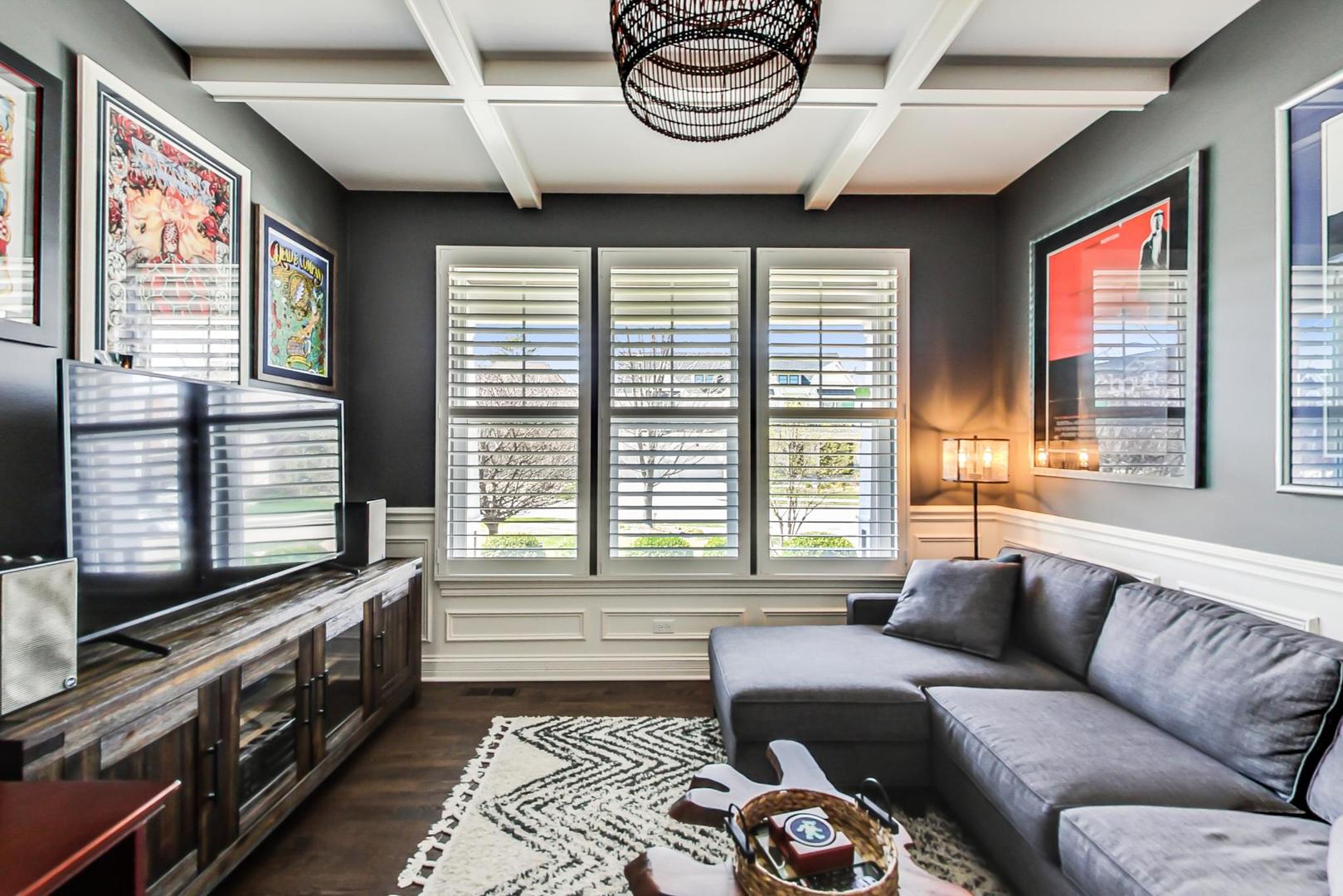 219 Clinton Avenue Elmhurst, IL 60126 - Photo 5 of 49 a living room with furniture and a window